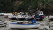 SX08777 Small boats on dry harbour floor in Newquay.jpg